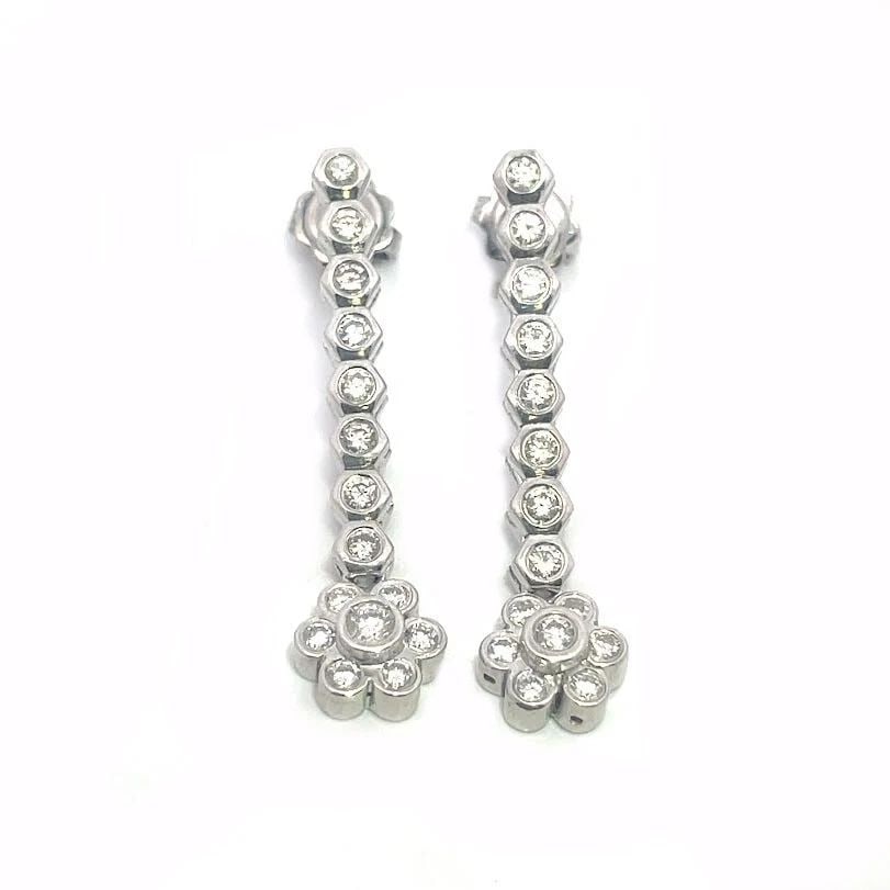 70188 DIAMOND 18K GOLD EARRINGS WHITE FLORAL DROP DANGLE STYLE: 70188 DIAMOND 18K GOLD EARRINGS WHITE FLORAL DROP DANGLE STYLE 70188 DIAMOND 18K GOLD EARRINGS WHITE FLORAL DROP DANGLE STYLE This is a gorgeous pair of long dangle earrings, they are crafted from 18k