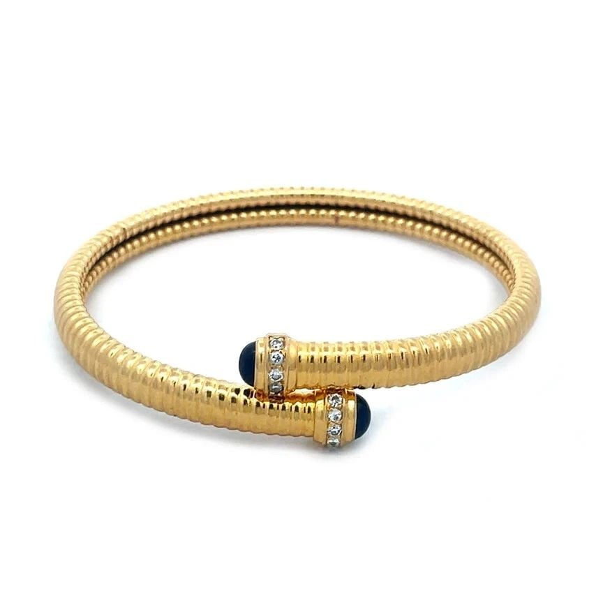 DIAMOND SAPPHIRE GOLD BANGLE FRANCE 18K YELLOW TUBOGAS BYPASS STYLE FLEX BAND: DIAMOND SAPPHIRE GOLD BANGLE FRANCE 18K YELLOW TUBOGAS BYPASS STYLE FLEX BAND DIAMOND SAPPHIRE GOLD BANGLE FRANCE 18K YELLOW TUBOGAS BYPASS STYLE FLEX BAND This lovely bracelet stamped France is craft