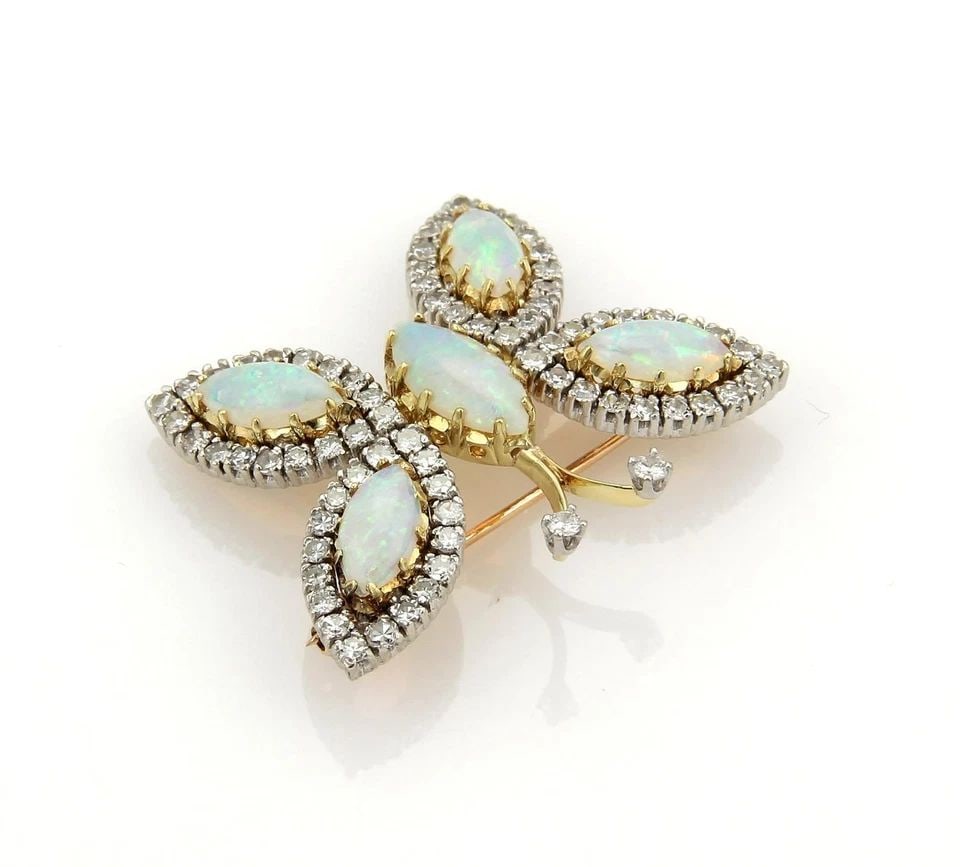 OPAL GOLD BUTTERFLY BROOCH DIAMOND 18K YELLOW VINTAGE: OPAL GOLD BUTTERFLY BROOCH DIAMOND 18K YELLOW VINTAGE OPAL GOLD BUTTERFLY BROOCH DIAMOND 18K YELLOW VINTAGE This adorable butterfly gold brooch features a stunning design with the marquise cut opals s