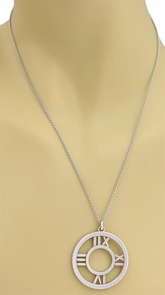 TIFFANY & CO. ATLAS 18K WHITE GOLD LARGE ROMAN NUMERAL PENDANT & CHAIN: TIFFANY & CO. ATLAS 18K WHITE GOLD LARGE ROMAN NUMERAL PENDANT & CHAIN TIFFANY & CO. ATLAS 18K WHITE GOLD LARGE ROMAN NUMERAL PENDANT & CHAIN Tiffany & Co. Atlas 18k White Gold Large Roman Numeral Pen