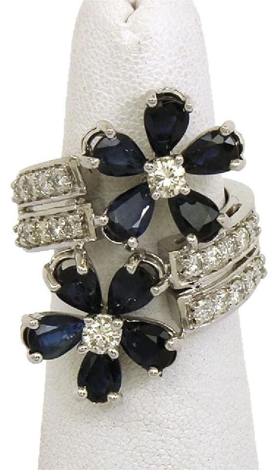 DIAMOND SAPPHIRE GOLD RING 14K WHITE ESTATE FLORAL BYPASS RING: DIAMOND SAPPHIRE GOLD RING 14K WHITE ESTATE FLORAL BYPASS RING DIAMOND SAPPHIRE GOLD RING 14K WHITE ESTATE FLORAL BYPASS RING This Diamond Sapphire Gold Ring is a stunning piece of vintage and antique