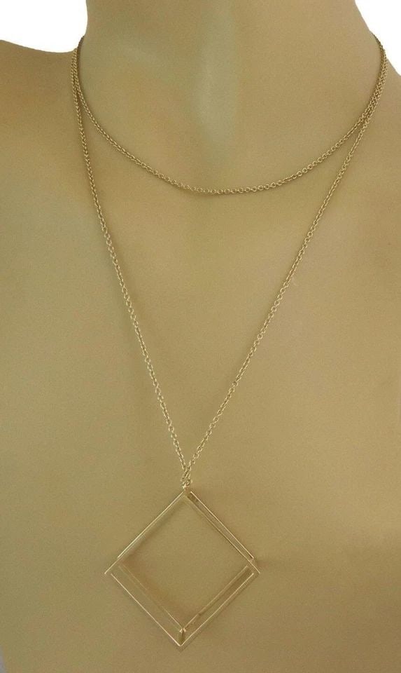 GOLD PENDANT RECTANGLE SHAPE 3D OPEN STYLE 18K YELLOW & CHAIN 35" LONG: GOLD PENDANT RECTANGLE SHAPE 3D OPEN STYLE 18K YELLOW & CHAIN 35" LONG This elegant gold pendant features a unique rectangle shape design with an open style, crafted from 18k yellow gold. The pendant 