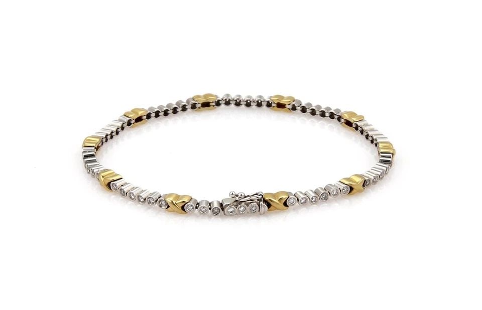 18K YELLOW & WHITE GOLD 1.00CT DIAMOND X LINK TENNIS BRACELET: 18K YELLOW & WHITE GOLD 1.00CT DIAMOND X LINK TENNIS BRACELET 18K YELLOW & WHITE GOLD 1.00CT DIAMOND X LINK TENNIS BRACELET 1.00ct Diamond X Link 18k Two Tone Gold Tennis Bracelet Description A fine t