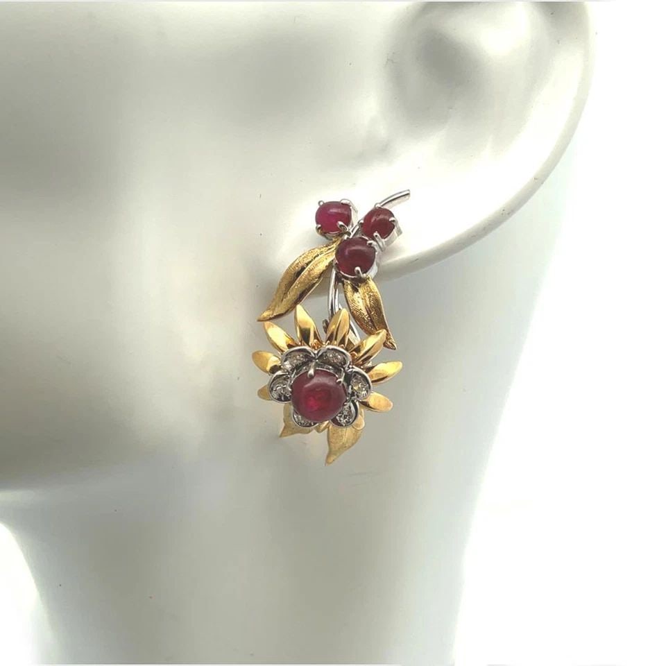 DIAMOND RUBY 18K TWO TONE GOLD FLORAL DANGLE EARRINGS: DIAMOND RUBY 18K TWO TONE GOLD FLORAL DANGLE EARRINGS DIAMOND RUBY 18K TWO TONE GOLD FLORAL DANGLE EARRINGS Diamond Ruby 18k Two Tone Gold Floral Dangle Earrings Description This is a beautiful pair o