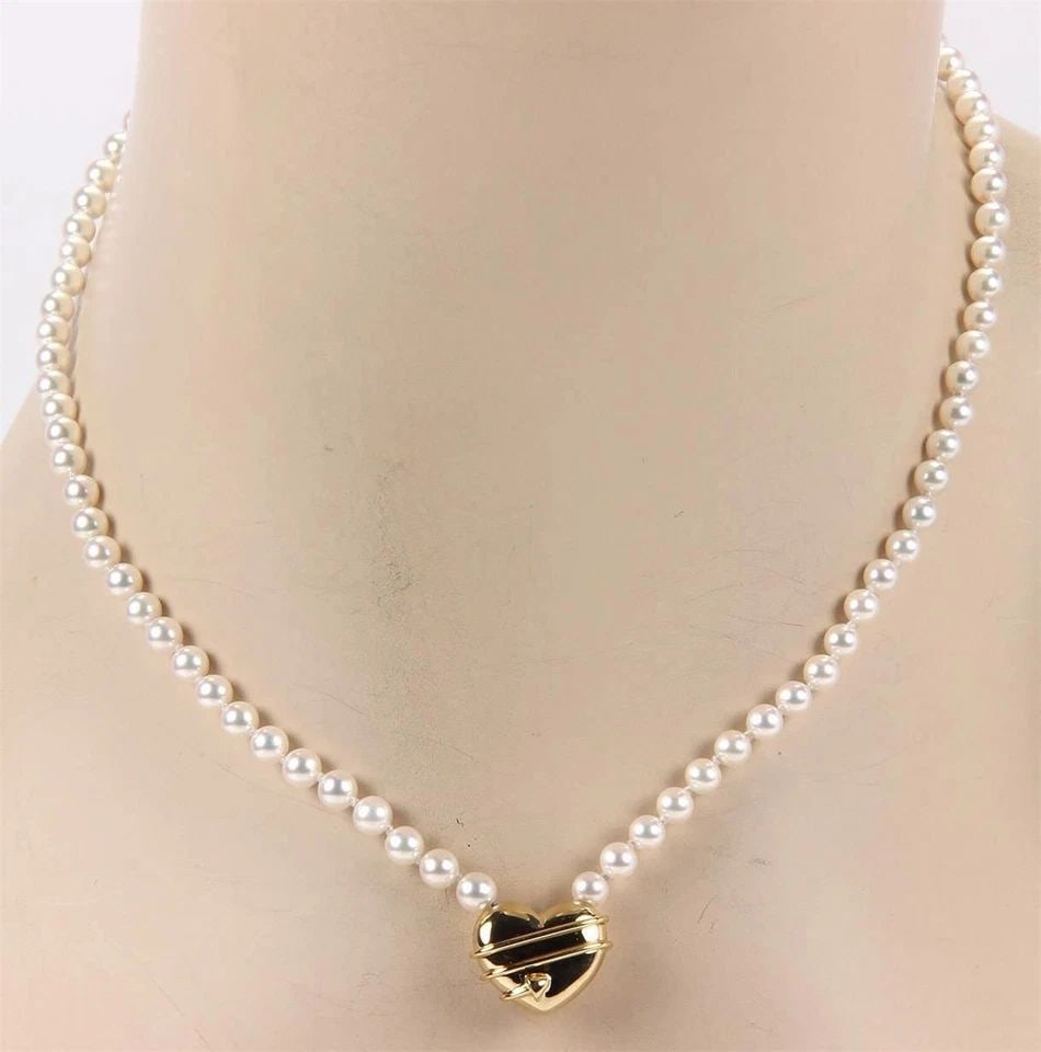 TIFFANY & CO. CUPID GOLD NECKLACE PEARLS 18K YELLOW ARROW HEART PENDANT: TIFFANY & CO. CUPID GOLD NECKLACE PEARLS 18K YELLOW ARROW HEART PENDANT TIFFANY & CO. CUPID GOLD NECKLACE PEARLS 18K YELLOW ARROW HEART PENDANT The Tiffany & Co. Cupid Gold Necklace is a luxurious pie