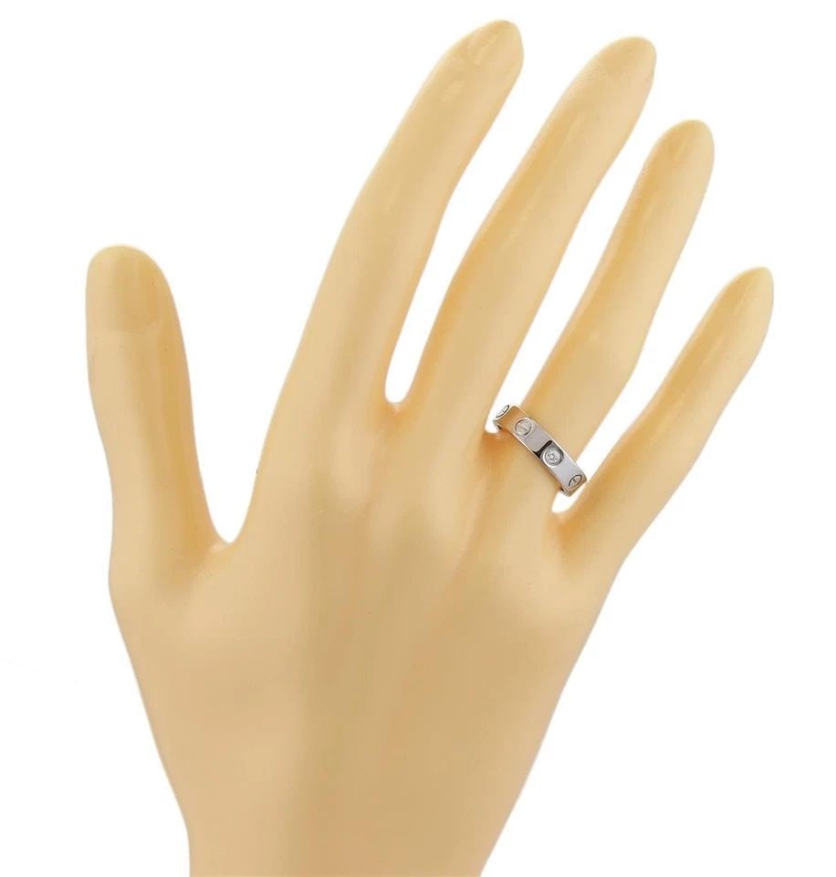 CARTIER MINI LOVE GOLD RING 1 DIAMOND 18K WHITE SIZE 50-US 5.25: CARTIER MINI LOVE GOLD RING 1 DIAMOND 18K WHITE SIZE 50-US 5.25 CARTIER MINI LOVE GOLD RING 1 DIAMOND 18K WHITE SIZE 50-US 5.25 This is an elegant ring by Cartier from the Mini Love Collection. It is 