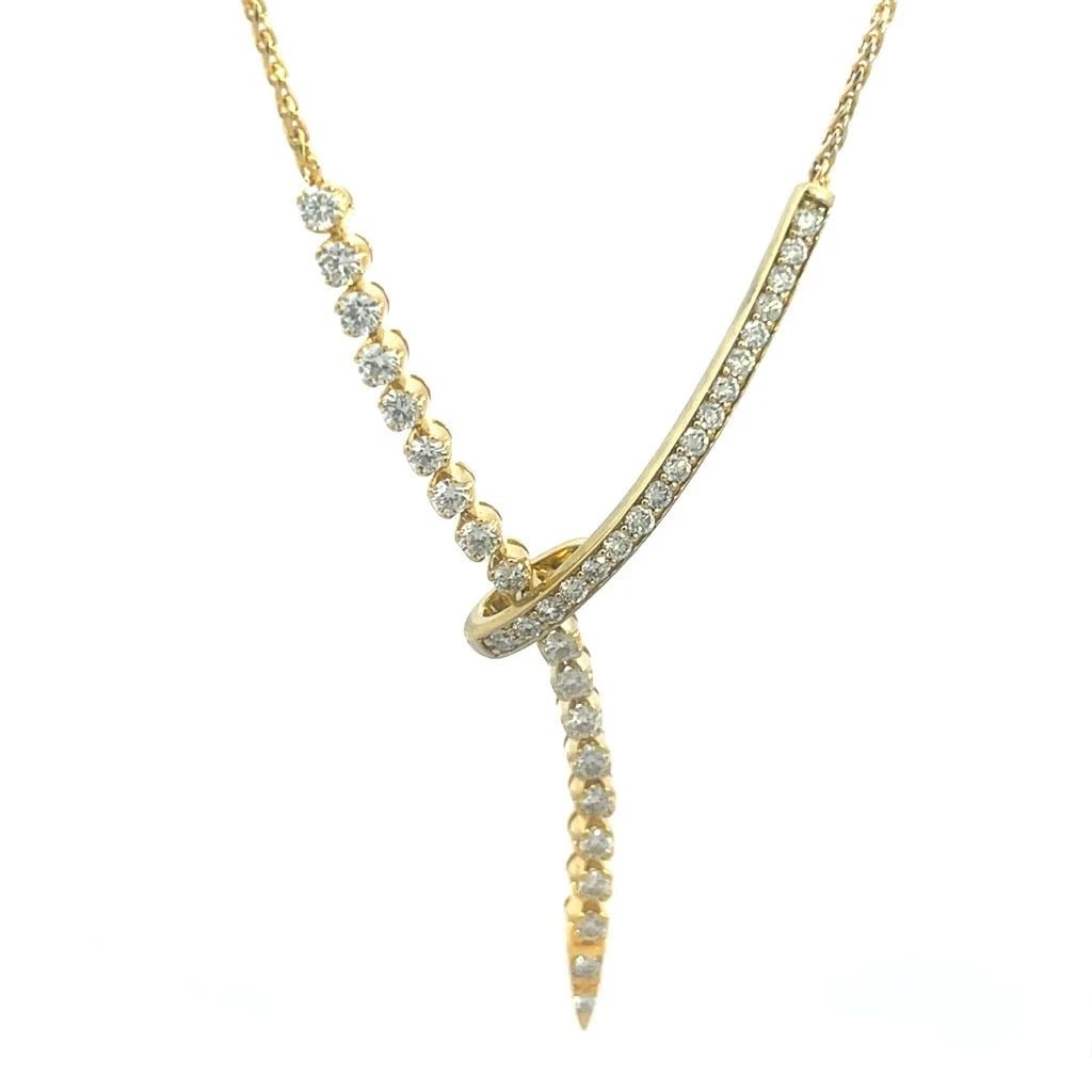DIAMOND GOLD GOLD NECKLACE 14K YELLOW CRISS-CROSS PENDANT: DIAMOND GOLD GOLD NECKLACE 14K YELLOW CRISS-CROSS PENDANT This is a beautiful diamond necklace. It features a dangling pendant with prong and channel set natural white diamond set in 14k yellow gold. 