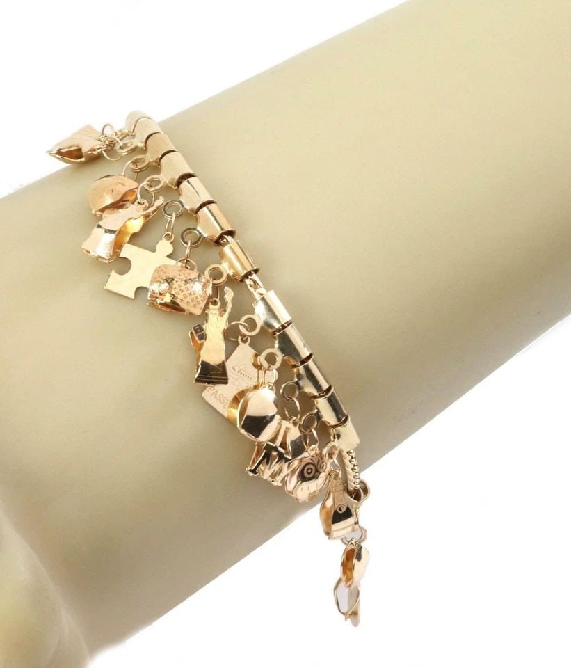 14K YELLOW GOLD 17 DANGLING MULTI-CHARMS CHAIN BRACELET: 14K YELLOW GOLD 17 DANGLING MULTI-CHARMS CHAIN BRACELET 14K YELLOW GOLD 17 DANGLING MULTI-CHARMS CHAIN BRACELET 14k Yellow Gold 17 Dangling Multi-Charms Chain Bracelet Description This is a multi dang