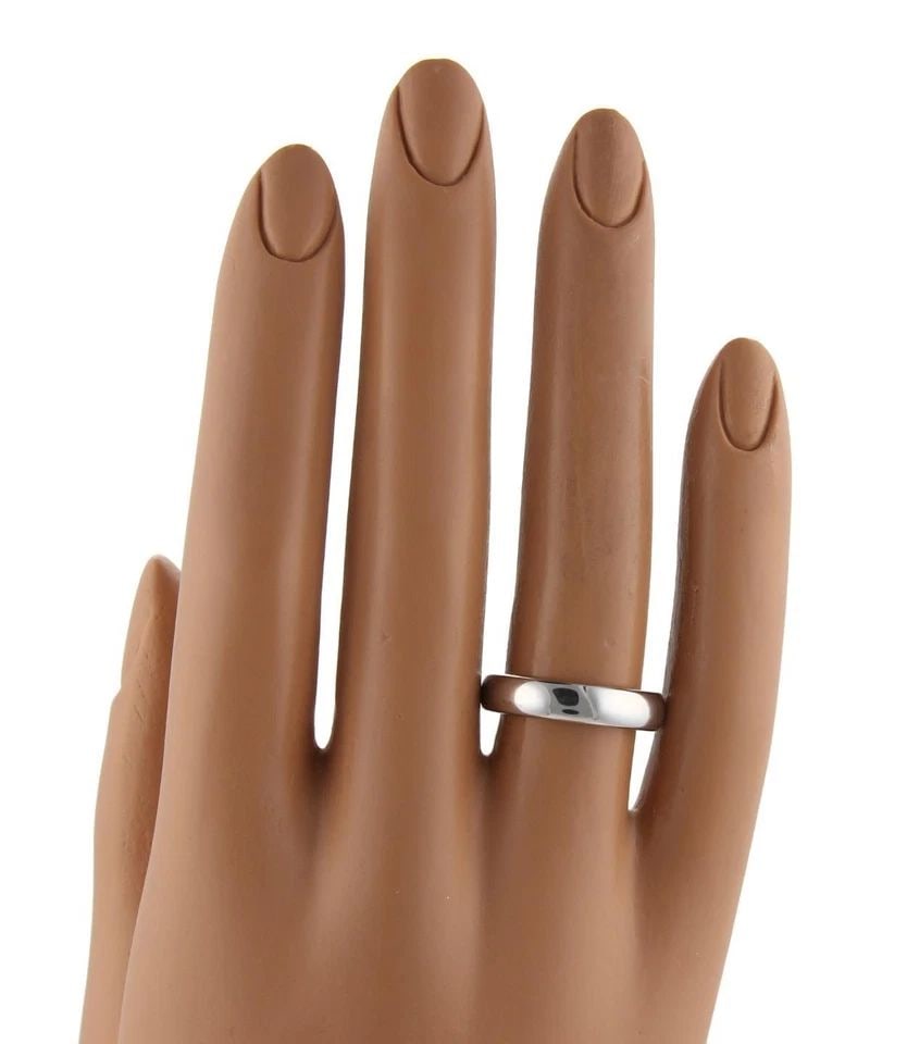 TIFFANY & CO. WEDDING BAND PLATINUM WIDE DOME RING: TIFFANY & CO. WEDDING BAND PLATINUM WIDE DOME RING TIFFANY & CO. WEDDING BAND PLATINUM WIDE DOME RING Tiffany & Co. Platinum 4.5mm Wide Dome Wedding Band Ring Size 7.75 Description This is an authenti
