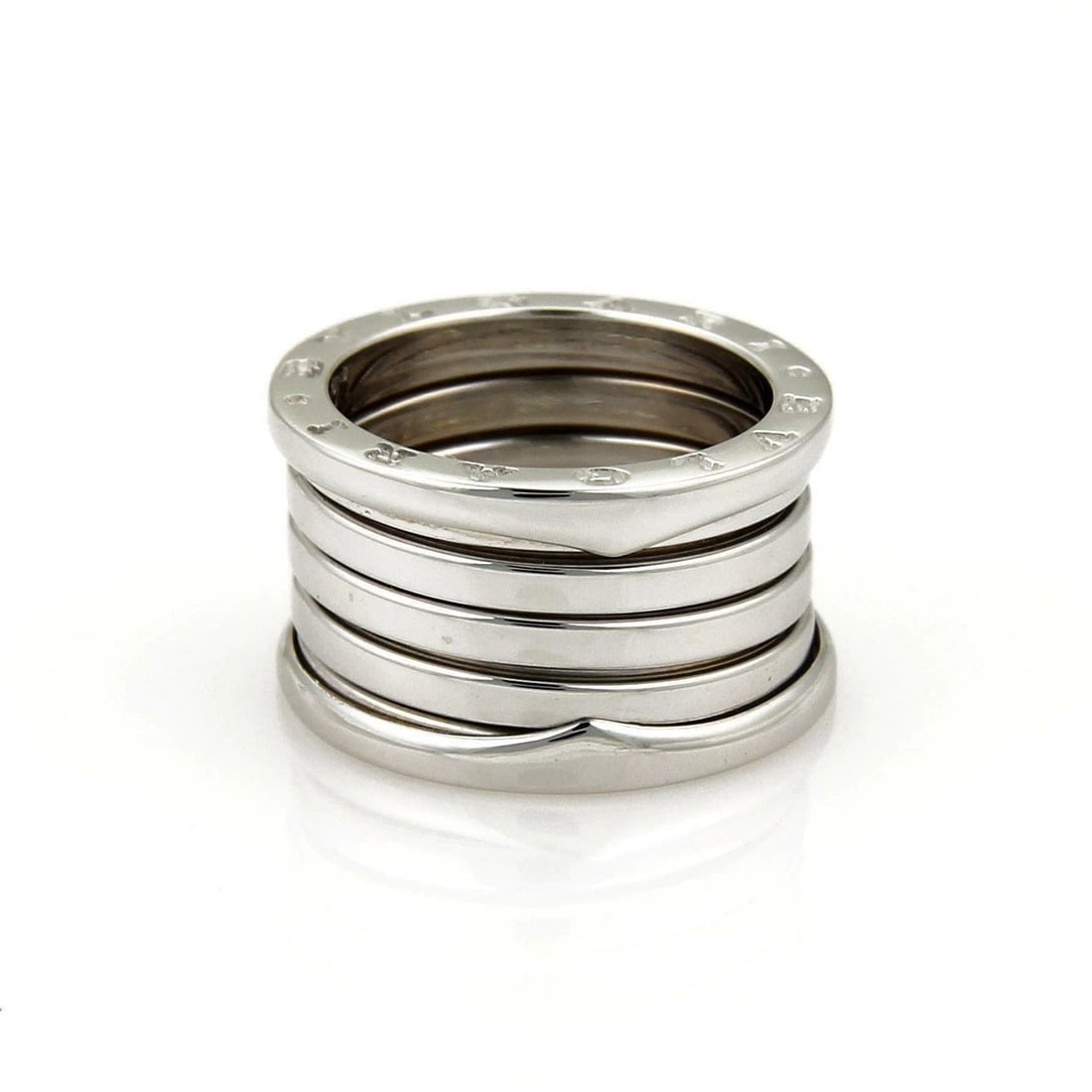 BULGARI RING B ZERO 1 18K WHITE GOLD 13MM BAND SIZE 49-US 4.5: BULGARI RING B ZERO 1 18K WHITE GOLD 13MM BAND SIZE 49-US 4.5 BULGARI RING B ZERO 1 18K WHITE GOLD 13MM BAND SIZE 49-US 4.5 The Bulgari Ring B Zero 1 in 18k White Gold with a 13mm Band is a luxurious 