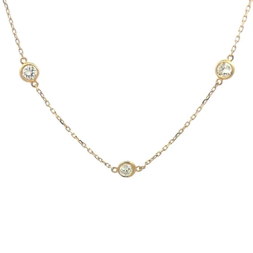 DIAMOND BY THE YARD GOLD NECKLACE 14K YELLOW BEZEL SET STYLE: DIAMOND BY THE YARD GOLD NECKLACE 14K YELLOW BEZEL SET STYLE DIAMOND BY THE YARD GOLD NECKLACE 14K YELLOW BEZEL SET STYLE The product is a stunning 14k yellow gold necklace with a bezel set style feat