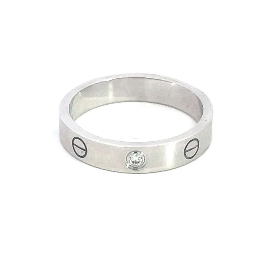 CARTIER LOVE 1 DIAMOND GOLD RING 18K WHITE MINI STYLE RING W/PAPER SIZE 55: CARTIER LOVE 1 DIAMOND GOLD RING 18K WHITE MINI STYLE RING W/PAPER SIZE 55 This gold ring is by Cartier from the Love Collection, it is in the mini style with one diamond and screw motifs set in 18k w