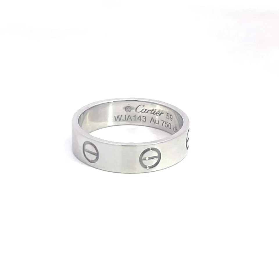 CARTIER LOVE GOLD RING 18K WHITE SCREW MOTIFS WIDE BAND SIZE 59: CARTIER LOVE GOLD RING 18K WHITE SCREW MOTIFS WIDE BAND SIZE 59 CARTIER LOVE GOLD RING 18K WHITE SCREW MOTIFS WIDE BAND SIZE 59 This elegant classic Cartier band is from the Love Collection, it is fro