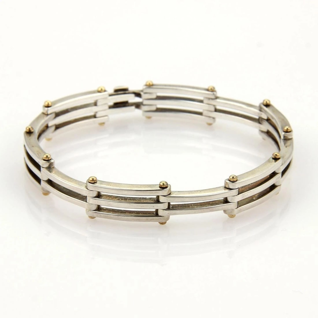TIFFANY & CO. GATELINK BRACELET STERLING SILVER 18K YELLOW GOLD SECTION LINK: TIFFANY & CO. GATELINK BRACELET STERLING SILVER 18K YELLOW GOLD SECTION LINK TIFFANY & CO. GATELINK BRACELET STERLING SILVER 18K YELLOW GOLD SECTION LINK This authentic Tiffany & Co. piece is finely c