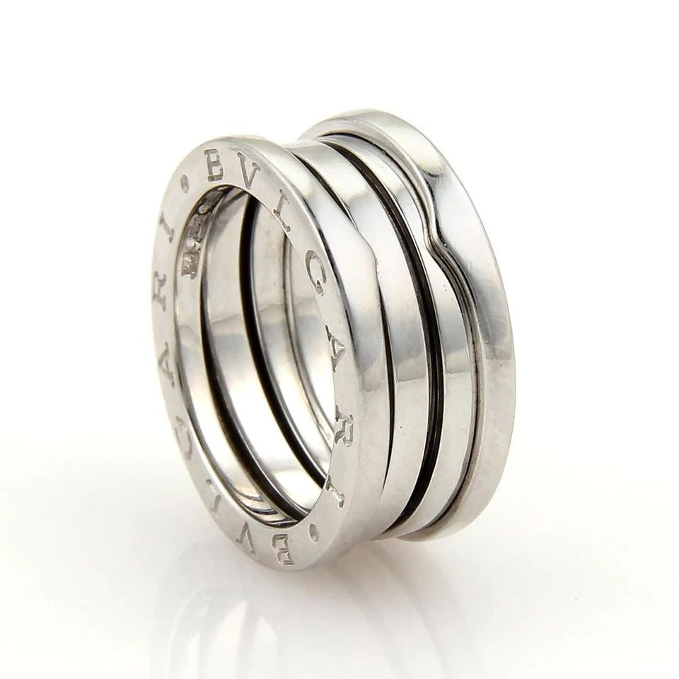 BVLGARI B ZERO-1 GOLD BAND 18K WHITE 4 ROW RING SIZE 48 -US 4: BVLGARI B ZERO-1 GOLD BAND 18K WHITE 4 ROW RING SIZE 48 -US 4 BVLGARI B ZERO-1 GOLD BAND 18K WHITE 4 ROW RING SIZE 48 -US 4 The Bvlgari B Zero-1 gold band 18k white 4 row ring is a luxurious and styli