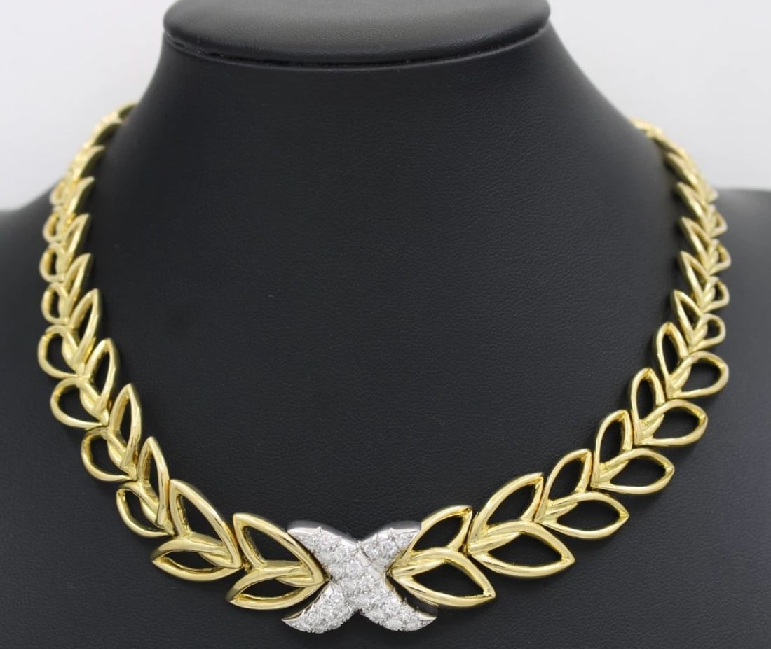 TIFFANY & CO. 18K YELLOW GOLD 3.25 TCW DIAMOND "X" CHOKER NECKLACE 15" ~ 93.3 GR: TIFFANY & CO. 18K YELLOW GOLD 3.25 TCW DIAMOND "X" CHOKER NECKLACE 15" ~ 93.3 GR Description Tiffany & Co. 18k Yellow Gold 3.25 TCW Diamond "X" Choker Necklace Necklace is in great condition. May show