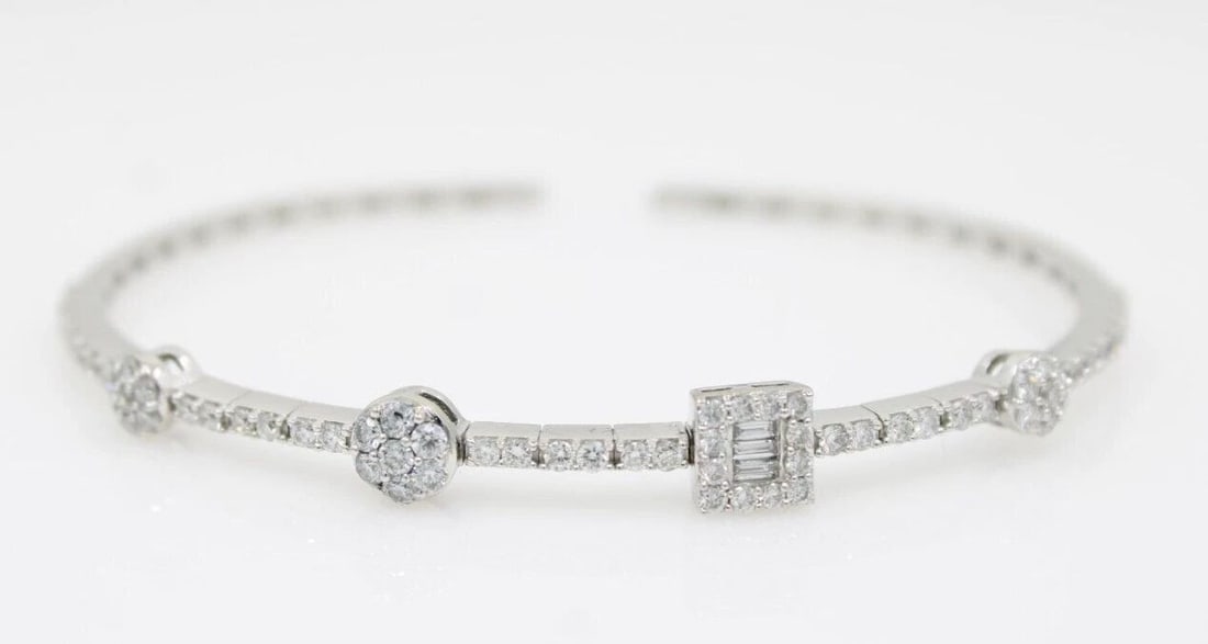 18K WHITE GOLD 1.24 TCW NATURAL DIAMOND CUFF BRACELET 7" - 8.9 GRAMS: 18K WHITE GOLD 1.24 TCW NATURAL DIAMOND CUFF BRACELET 7" - 8.9 GRAMS 18K WHITE GOLD 1.24 TCW NATURAL DIAMOND CUFF BRACELET 7" - 8.9 GRAMS Description 18K White Gold 1.24 TCW Natural Diamond Cuff Brace