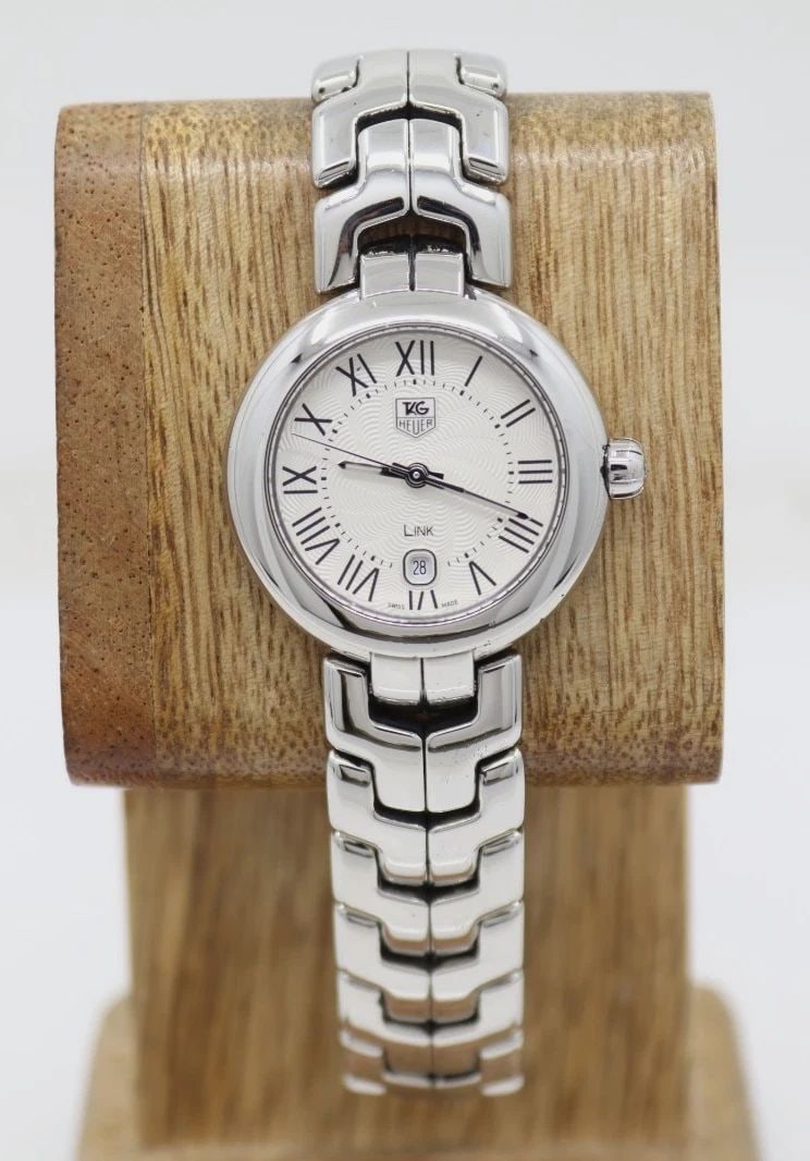 TAG HEUER LINK 29MM WHITE DIAL ROMAN STEEL SWISS QUARTZ WOMEN'S WATCH WAT1416: TAG HEUER LINK 29MM WHITE DIAL ROMAN STEEL SWISS QUARTZ WOMEN'S WATCH WAT1416 Description Tag Heuer Link 29 mm White Dial Roman Steel Swiss Quartz Women's Watch WAT1416 The watch has been used previou