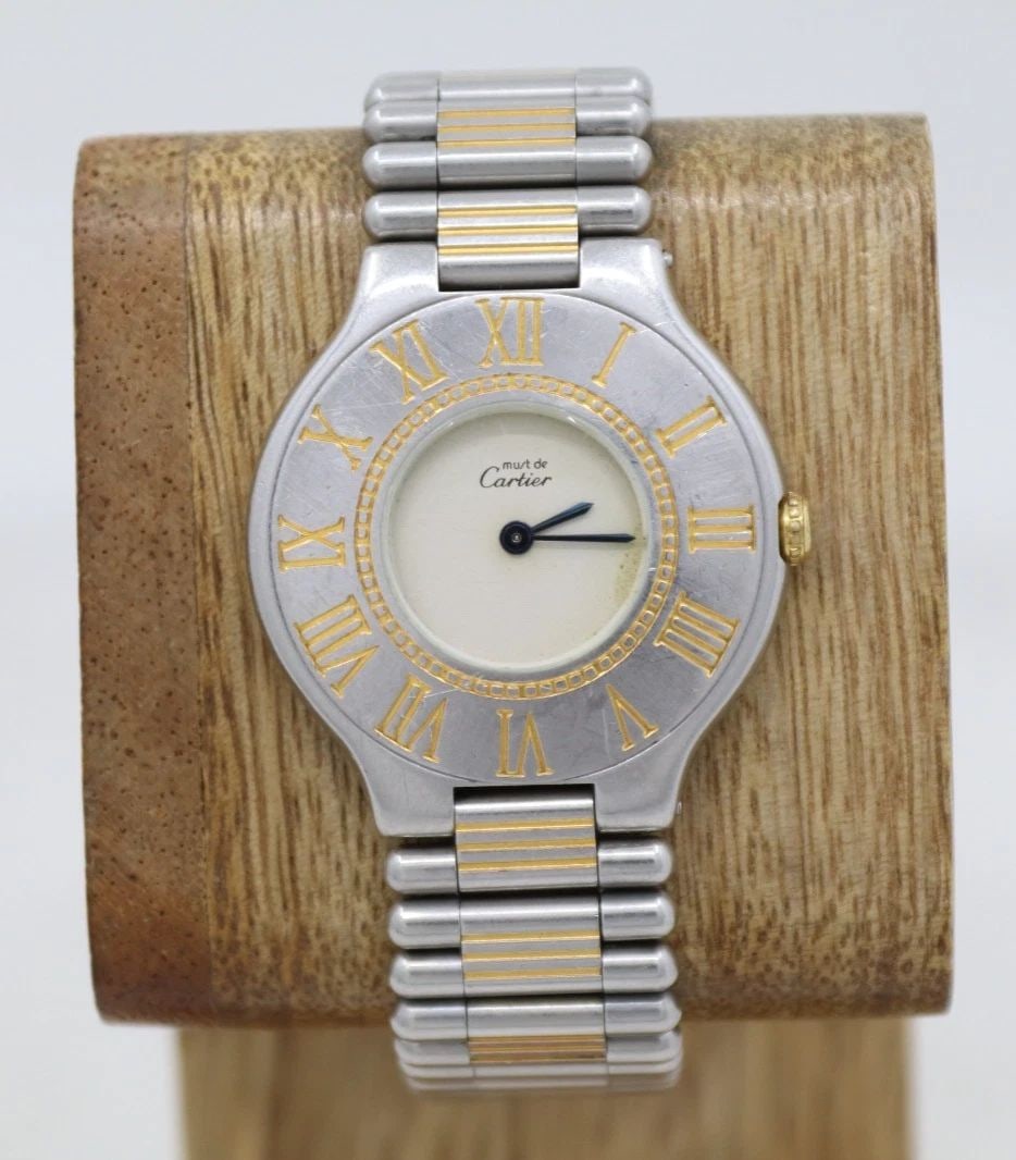 CARTIER MUST DE 21 TWO-TONE 31MM IVORY DIAL QUARTZ WATCH UNPOLISHED RUNNING: CARTIER MUST DE 21 TWO-TONE 31MM IVORY DIAL QUARTZ WATCH UNPOLISHED RUNNING Description Cartier Must de 21 Two-Tone 31mm Ivory Dial Quartz Watch Unpolished Running The watch has been used previously. 