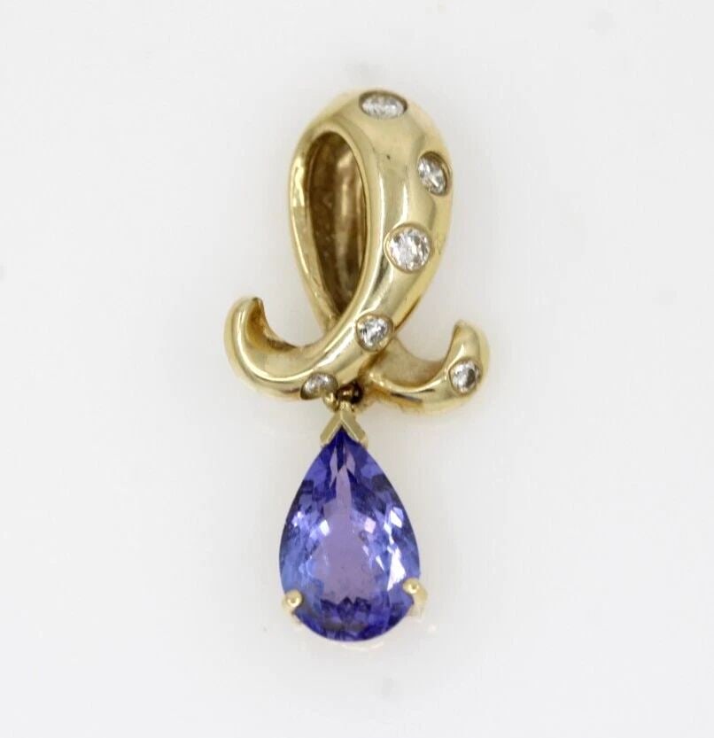 LEVIAN 14K YELLOW GOLD BLUE TANZANITE & DIAMOND PENDANT 3.2 GRAMS: LEVIAN 14K YELLOW GOLD BLUE TANZANITE & DIAMOND PENDANT 3.2 GRAMS LEVIAN 14K YELLOW GOLD BLUE TANZANITE & DIAMOND PENDANT 3.2 GRAMS Description LeVian 14K Yellow Gold Blue Tanzanite & Diamond Pendant 