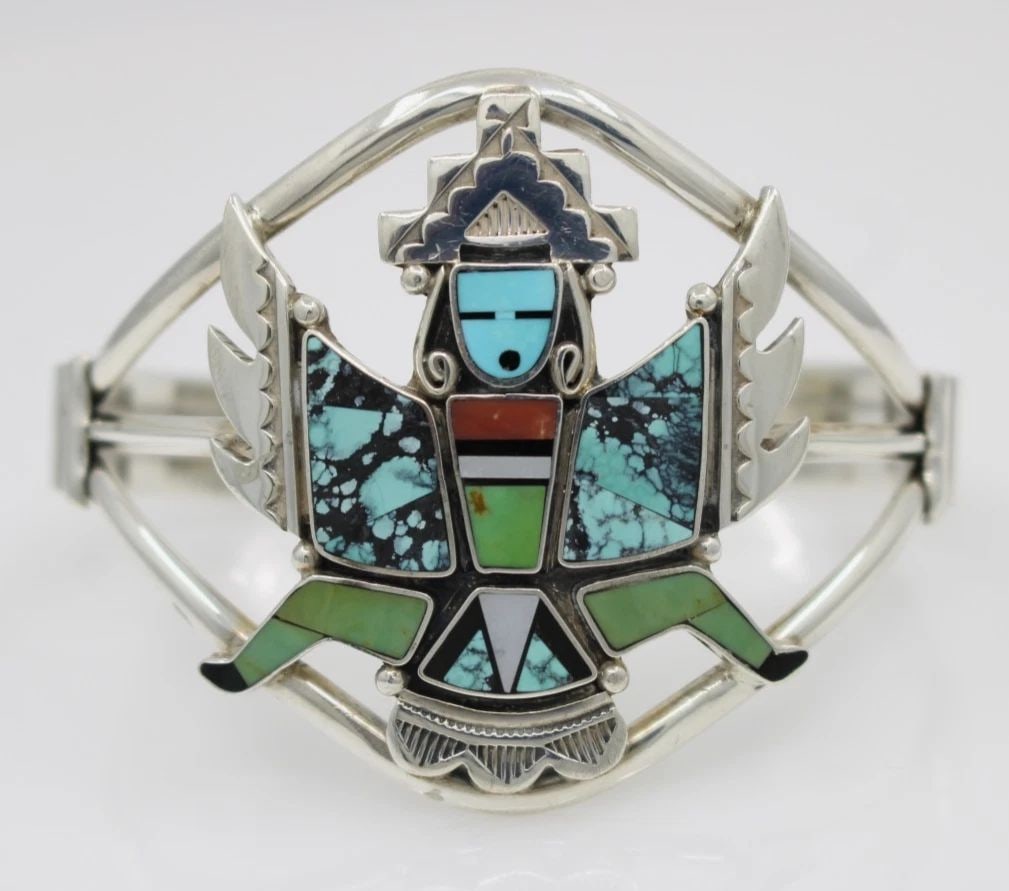 NAVAJO DANNY D. CLARK STERLING SILVER KNIFEWING DANCER TURQUOISE INLAY CUFF 6": NAVAJO DANNY D. CLARK STERLING SILVER KNIFEWING DANCER TURQUOISE INLAY CUFF 6" Description Navajo Danny D. Clark Sterling Silver Knifewing Dancer Turquoise Inlay Cuff Bracelet is in good condition. Ma