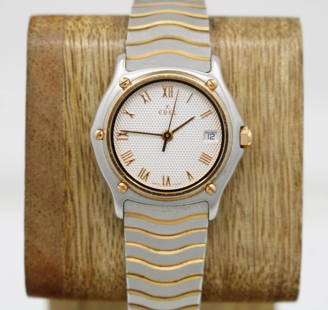 EBEL SPORT CLASSIQUE TWO TONE 18K GOLD 27MM SILVER DIAL DATE WATCH 1087123: EBEL SPORT CLASSIQUE TWO TONE 18K GOLD 27MM SILVER DIAL DATE WATCH 1087123 Description EBEL Sport Classique Two Tone 18K Gold 27mm Silver Dial Date Watch 1087123 The watch has been used previously. Th