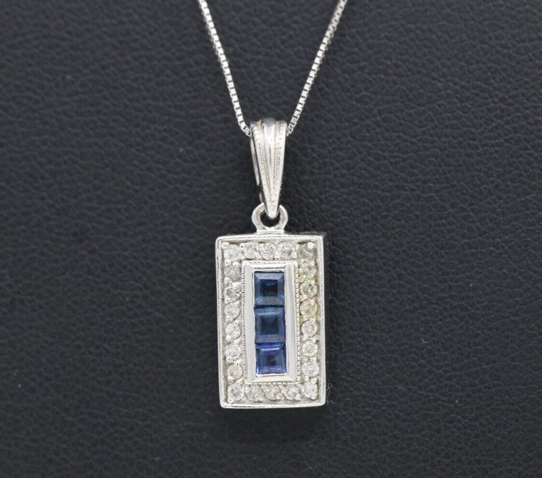 VINTAGE 14K WHITE GOLD NATURAL BLUE SAPPHIRE & DIAMOND PENDANT W/ 18" NECKLACE: VINTAGE 14K WHITE GOLD NATURAL BLUE SAPPHIRE & DIAMOND PENDANT W/ 18" NECKLACE VINTAGE 14K WHITE GOLD NATURAL BLUE SAPPHIRE & DIAMOND PENDANT W/ 18" NECKLACE Description Vintage 14K White Gold Natural