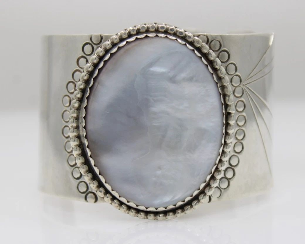 H STERLING SILVER NAVAJO MOTHER OF PEARL CUFF BRACELET 6 1/4" - 85.1 GRAMS: H STERLING SILVER NAVAJO MOTHER OF PEARL CUFF BRACELET 6 1/4" - 85.1 GRAMS Description H Signed Sterling Silver Navajo Mother of Pearl Cuff Bracelet Bracelet is in good condition. May show signs of we