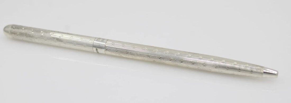 TIFFANY & CO. STERLING SILVER BALLPOINT PEN GERMANY W/ BOX & POUCH: TIFFANY & CO. STERLING SILVER BALLPOINT PEN GERMANY W/ BOX & POUCH Description Tiffany & Co. Sterling Silver Ballpoint Pen w/ Box & Pouch Pen is in good condition. May show signs of wear and/or tear. 