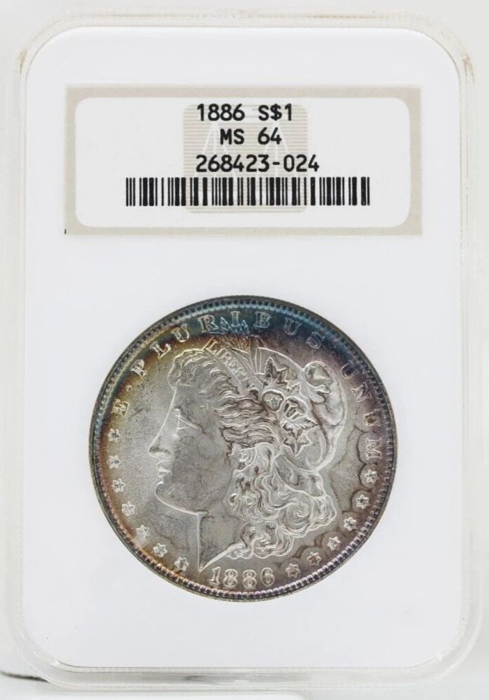 1886 MORGAN SILVER DOLLAR NGC MS-64 OLD FAT HOLDER RAINBOW TONING: 1886 MORGAN SILVER DOLLAR NGC MS-64 OLD FAT HOLDER RAINBOW TONING 1886 MORGAN SILVER DOLLAR NGC MS-64 OLD FAT HOLDER RAINBOW TONING Description 1886 Morgan Silver Dollar NGC MS-64 Old Fat Holder Rainb