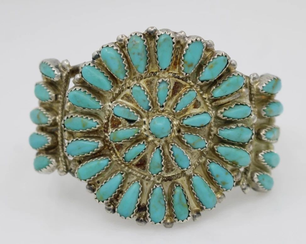 STERLING SILVER TURQUOISE FLOWER CUFF BRACELET 6" - 35.6 GRAMS: STERLING SILVER TURQUOISE FLOWER CUFF BRACELET 6" - 35.6 GRAMS Description Sterling Silver Turquoise Flower Cuff Bracelet Bracelet is in good condition. May show signs of wear and/or tear. Approximate