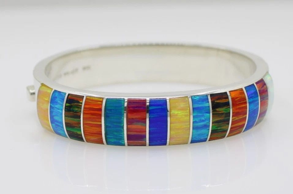 STERLING SILVER 950 MULTI INLAY GEMSTONE HINGED BANGLE BRACELET 6" - 46.9 G: STERLING SILVER 950 MULTI INLAY GEMSTONE HINGED BANGLE BRACELET 6" - 46.9 G Description Sterling Silver 950 Multi Inlay Gemstone Hinged Bangle Bracelet Bracelet is in good condition. May show signs of