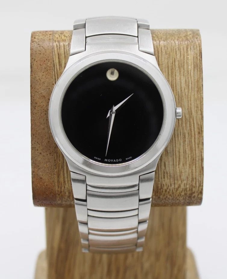 MOVADO KARDELO STAINLESS 36MM BLACK DIAL WATCH 84 G2 1851 W/ BOX & PAPERS: MOVADO KARDELO STAINLESS 36MM BLACK DIAL WATCH 84 G2 1851 W/ BOX & PAPERS Description Movado Kardelo Stainless 36mm Black Dial Watch 84 G2 1851 W/ Box & Papers The watch has been used previously. The 