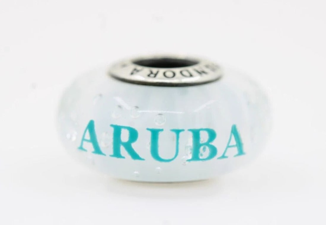 AUTHENTIC ALE PANDORA STERLING SILVER ARUBA MURANO CHARM 2.9 GRAMS: AUTHENTIC ALE PANDORA STERLING SILVER ARUBA MURANO CHARM 2.9 GRAMS Description Authentic ALE Pandora Sterling Silver Aruba Murano Glass Charm Pandora charm is in good condition. May show signs of wear