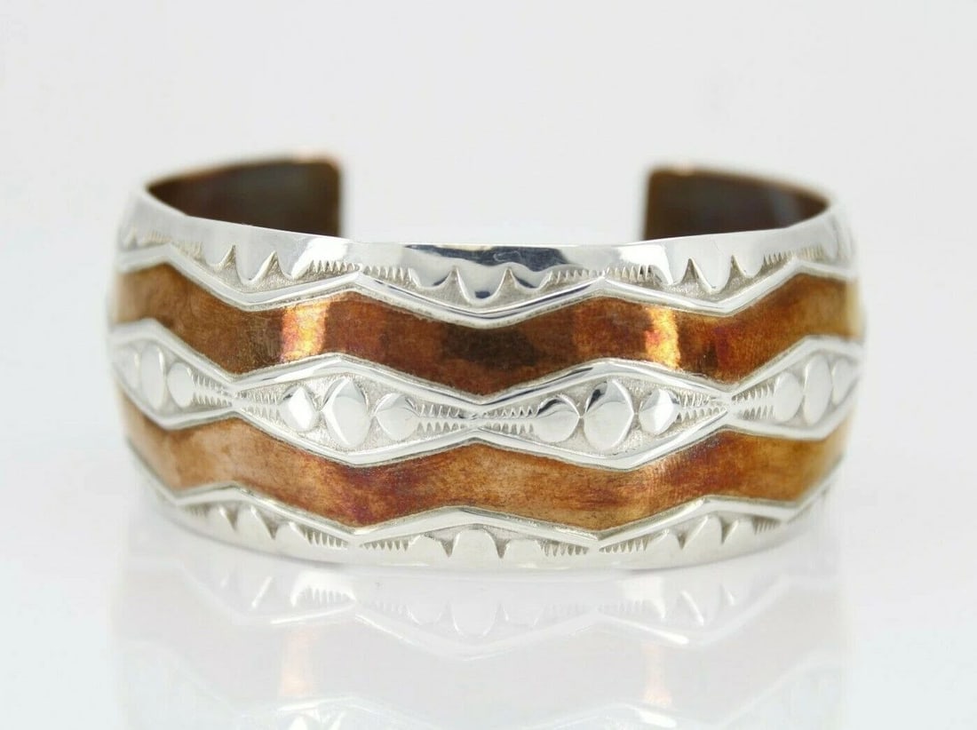 DOUGLAS ETSITTY NAVAJO NATIVE AMERICAN COPPER & STERLING CUFF BRACELET: DOUGLAS ETSITTY NAVAJO NATIVE AMERICAN COPPER & STERLING CUFF BRACELET Description Douglas Etsitty Navajo Native American Copper & Sterling Silver Cuff Bracelet Item is in great condition. May show si