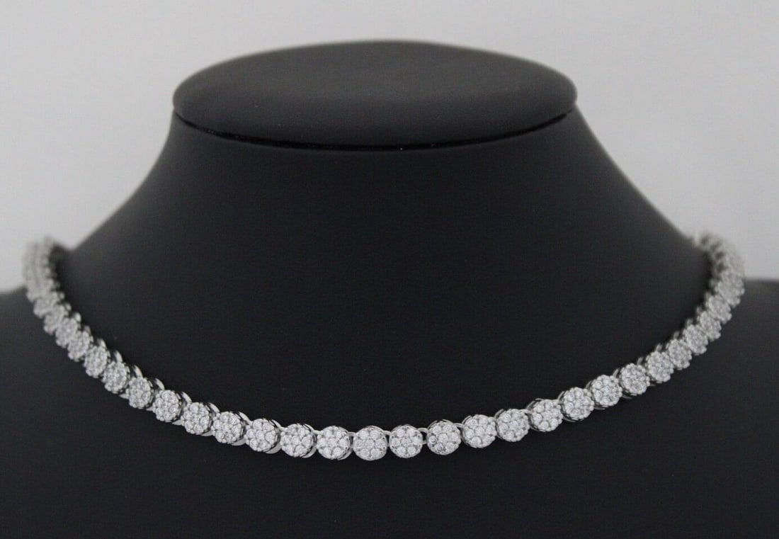 STERLING SILVER 5.5 MM CLUSTER FLOWER STATION TENNIS 16.5" NECKLACE 41.3 GR: STERLING SILVER 5.5 MM CLUSTER FLOWER STATION TENNIS 16.5" NECKLACE 41.3 GR Description Sterling Silver 5.5 mm Cluster Flower Station Tennis 16.5" Necklace Necklace is in great condition. May show sig