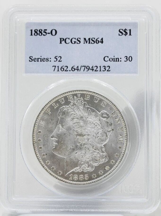 1885 O MORGAN SILVER DOLLAR $1 PCGS MS64: 1885 O MORGAN SILVER DOLLAR $1 PCGS MS64 1885 O MORGAN SILVER DOLLAR $1 PCGS MS64 Description 1885 O Morgan Silver Dollar $1 PCGS MS64 Coins has been graded as a MS-64 by NGC. The protective plastic h