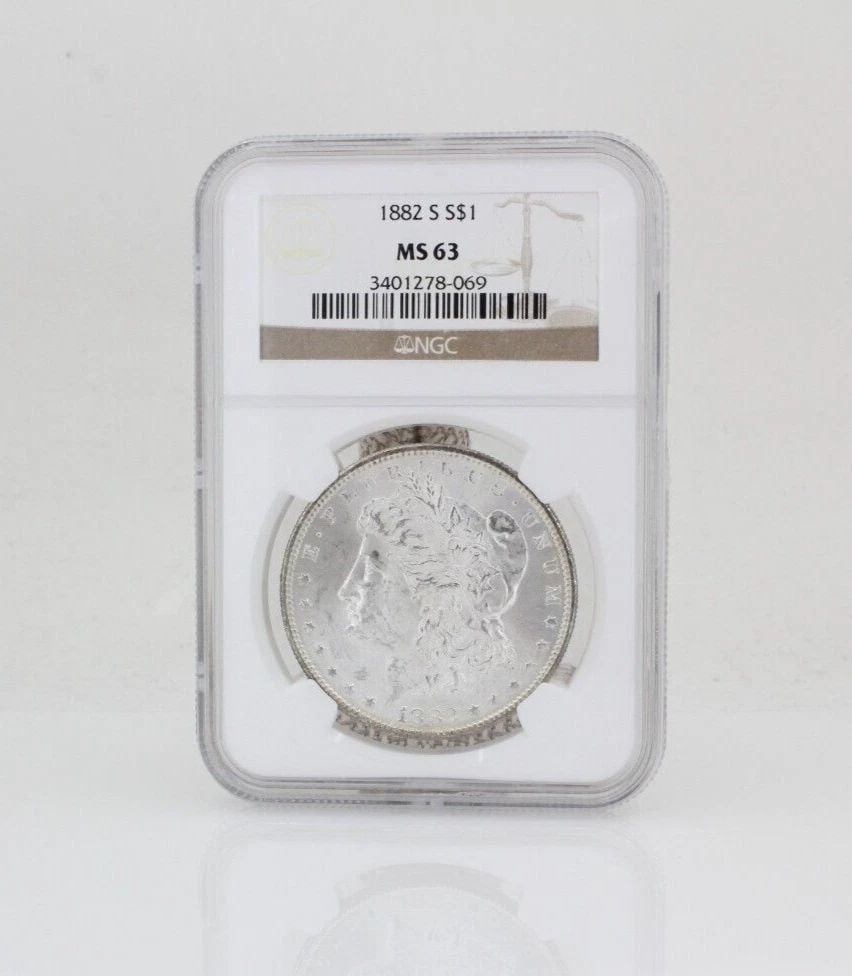 1882 S $1 MORGAN SILVER DOLLAR NGC MS 63: 1882 S $1 MORGAN SILVER DOLLAR NGC MS 63 1882 S $1 MORGAN SILVER DOLLAR NGC MS 63 Description 1882 S $1 Morgan Silver Dollar NGC MS 63 Coin is in great condition. Plastic covering may show signs of we
