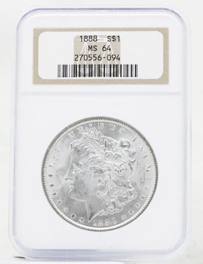 1888 P MORGAN SILVER DOLLAR NGC MS-64 OLD NGC HOLDER: 1888 P MORGAN SILVER DOLLAR NGC MS-64 OLD NGC HOLDER Description 1888 P Morgan Silver Dollar NGC MS-64 Old NGC Holder Coins has been graded as a MS-64 by NGC. The protective plastic holder may show si
