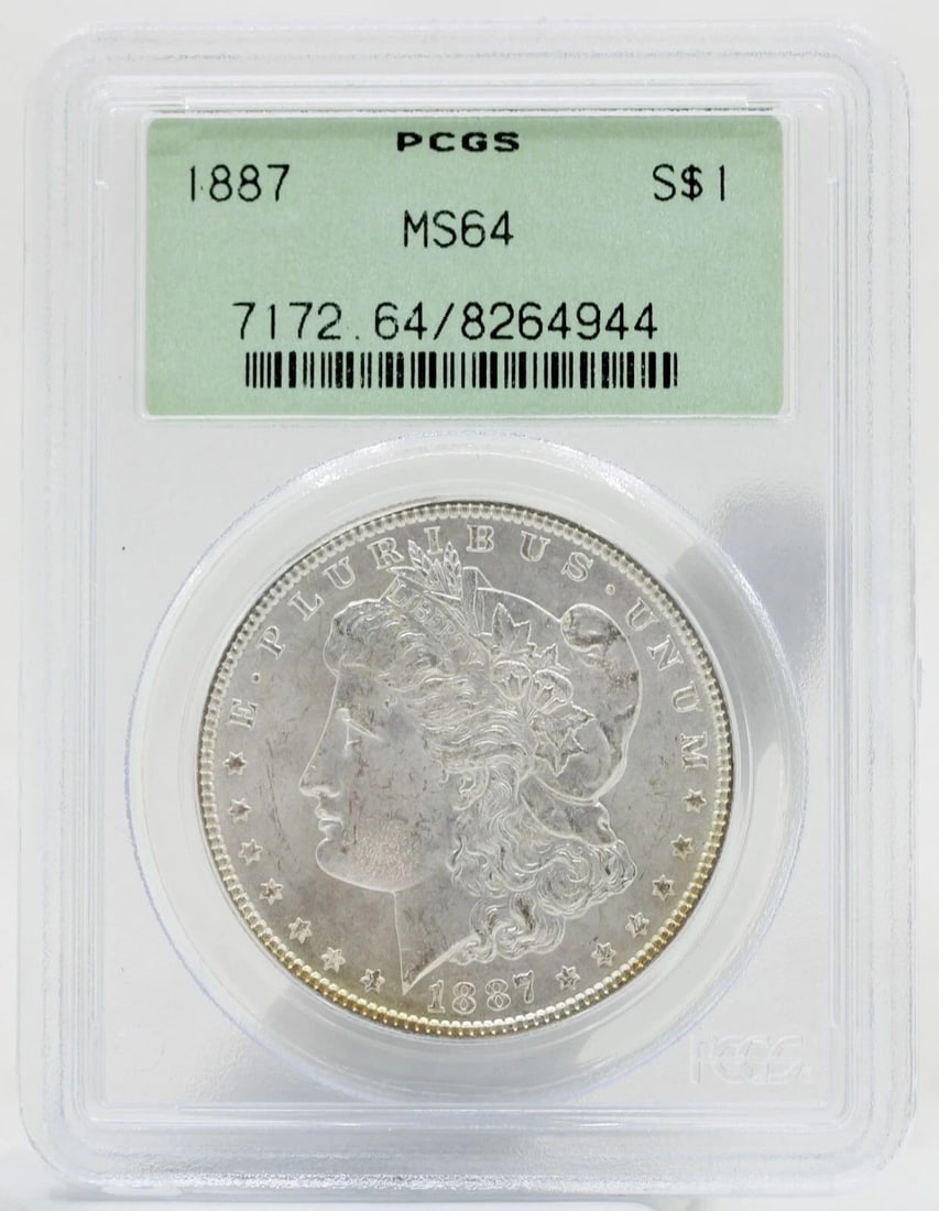 1887 MORGAN SILVER DOLLAR $1 PCGS MS64 OLD GREEN HOLDER LIGHT TONING: 1887 MORGAN SILVER DOLLAR $1 PCGS MS64 OLD GREEN HOLDER LIGHT TONING Description 1887 Morgan Silver Dollar $1 PCGS MS64 Old Green Holder Light Toning Coins has been graded as a MS-64 by NGC. The prote