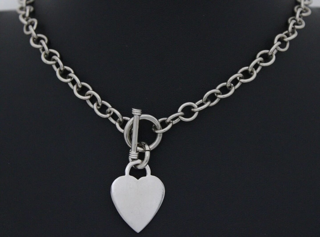 STERLING SILVER 16" CABLE CHAIN NECKLACE WITH 1" HEART TAG PENDANT ~ 45.7 GRAMS: STERLING SILVER 16" CABLE CHAIN NECKLACE WITH 1" HEART TAG PENDANT ~ 45.7 GRAMS Description Sterling Silver 16" Cable Chain Necklace with 1" Heart Tag Pendant Necklace in great condition. May show sig