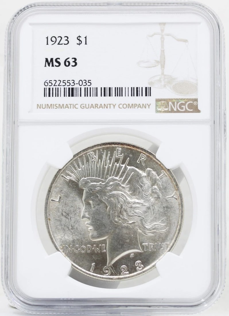 1923-P PEACE SILVER DOLLAR MS-63 NGC: 1923-P PEACE SILVER DOLLAR MS-63 NGC Description 1923-P Peace Silver Dollar MS-63 NGC Coins has been graded as a MS-63 by NGC. The protective plastic holder may show signs of shelf wear and/or tear. T