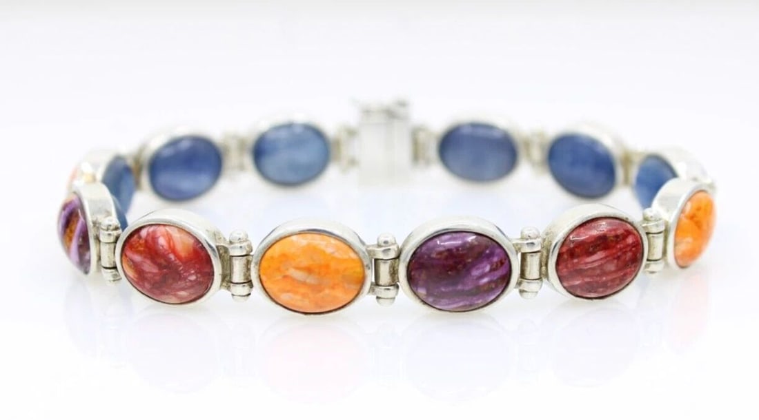 JAY KING STERLING SILVER REVERSIBLE MULTI GEMSTONE BRACELET 7" - 26.4 GRAMS: JAY KING STERLING SILVER REVERSIBLE MULTI GEMSTONE BRACELET 7" - 26.4 GRAMS Description Jay King Sterling Silver Reversible Multi Gemstone Bracelet The bracelet is in good condition. May show signs of