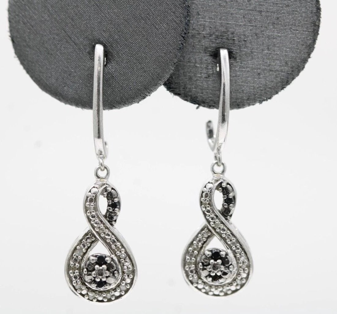 JANE SEYMORE JWBR STERLING SILVER NATURAL DIAMOND DANGLE EARRINGS: JANE SEYMORE JWBR STERLING SILVER NATURAL DIAMOND DANGLE EARRINGS JANE SEYMORE JWBR STERLING SILVER NATURAL DIAMOND DANGLE EARRINGS Description Jane Seymore JWBR Sterling Silver Natural Diamond Dangle