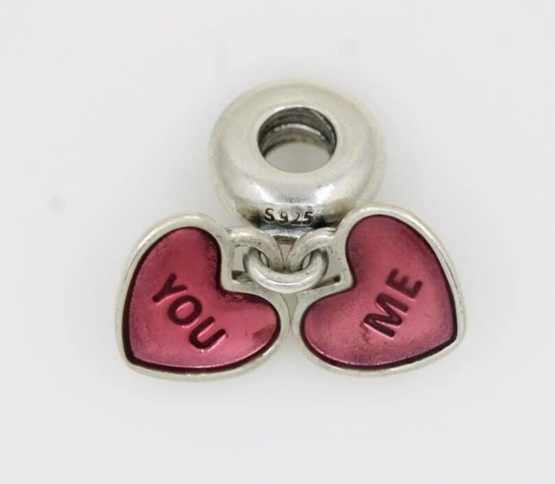 PANDORA STERLING SILVER YOU & ME DANGLE HEART CHARM 791244CZ: PANDORA STERLING SILVER YOU & ME DANGLE HEART CHARM 791244CZ Description Pandora Sterling Silver You & Me Dangle Heart Charm 791244CZ Pandora charm is in good condition. May show signs of wear and/or 