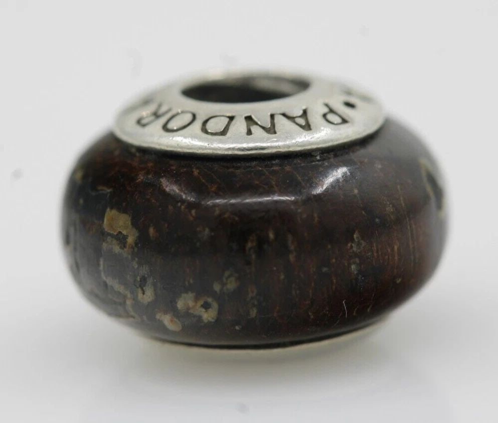 PANDORA STERLING SILVER ACAPO WOOD BEAD CHARM 790701 - 2.4 GRAMS: PANDORA STERLING SILVER ACAPO WOOD BEAD CHARM 790701 - 2.4 GRAMS Description Pandora Sterling Silver Best Mom Heart Charm 791882 Pandora charm in good condition. May show signs of wear and/or tear. It