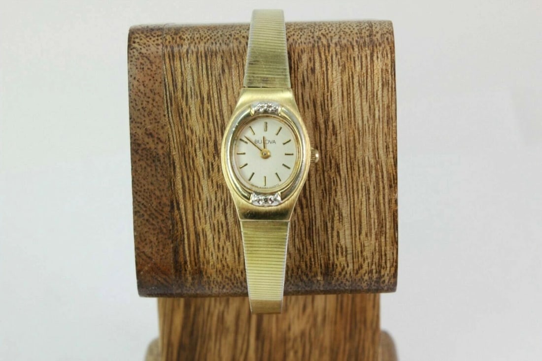 BULOVA DIAMOND & GOLD PLATED ACCENT BEZEL GOLD TONE STAINLESS ST. BRACELET WATCH: BULOVA DIAMOND & GOLD PLATED ACCENT BEZEL GOLD TONE STAINLESS ST. BRACELET WATCH Bulova Diamond & Gold Plated Accent Bezel Gold Tone Stainless Steel Bracelet Watch NEW battery installed great working 