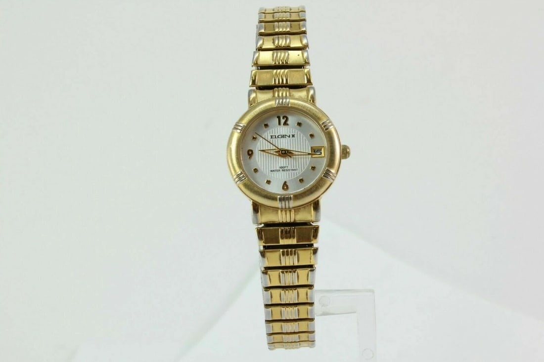 LADIES ELGIN WHITE DIAL GOLD TONE EXPANSION BAND DATE QUARTZ WATCH ELT016: LADIES ELGIN WHITE DIAL GOLD TONE EXPANSION BAND DATE QUARTZ WATCH ELT016 Description Ladies Elgin White Dial Gold Tone Expansion Band Date Quartz Watch ELT016 New Battery Installed. In great working 