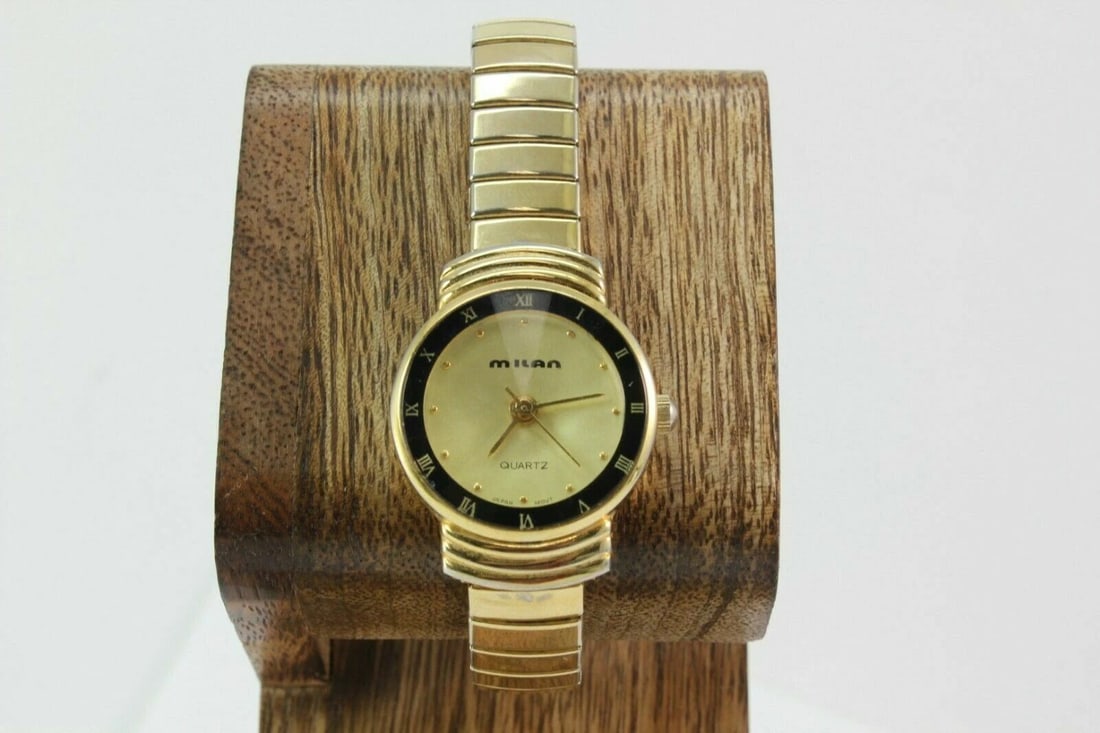 MILAN MLN1002 ROMAN NUMERAL BEZEL GOLD TONE STRETCH STAINLESS STEEL WATCH (1 of 2)