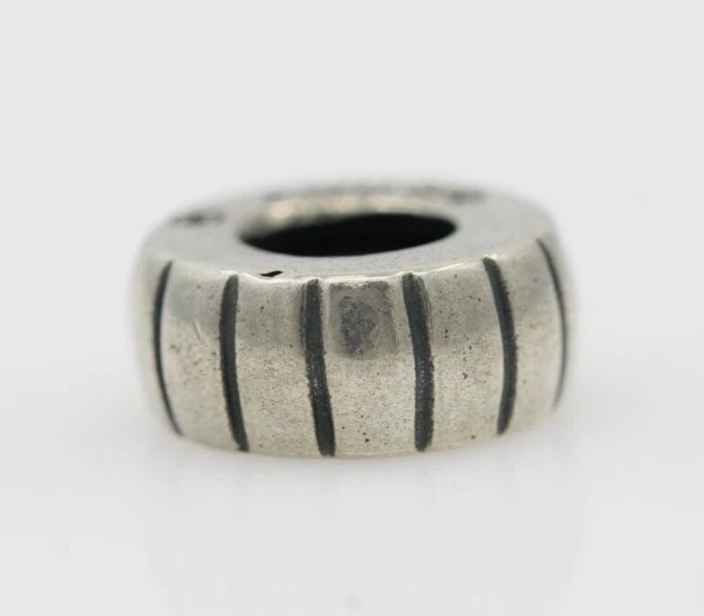 STERLING SILVER ITALY BLACK GROOVED SPACER SLIDER CHARM 1.3 GRAMS: STERLING SILVER ITALY BLACK GROOVED SPACER SLIDER CHARM 1.3 GRAMS Description Sterling Silver Italy Black Grooved Spacer Slider Charm "Two charms available. One charm per purchase price." Charm is in 